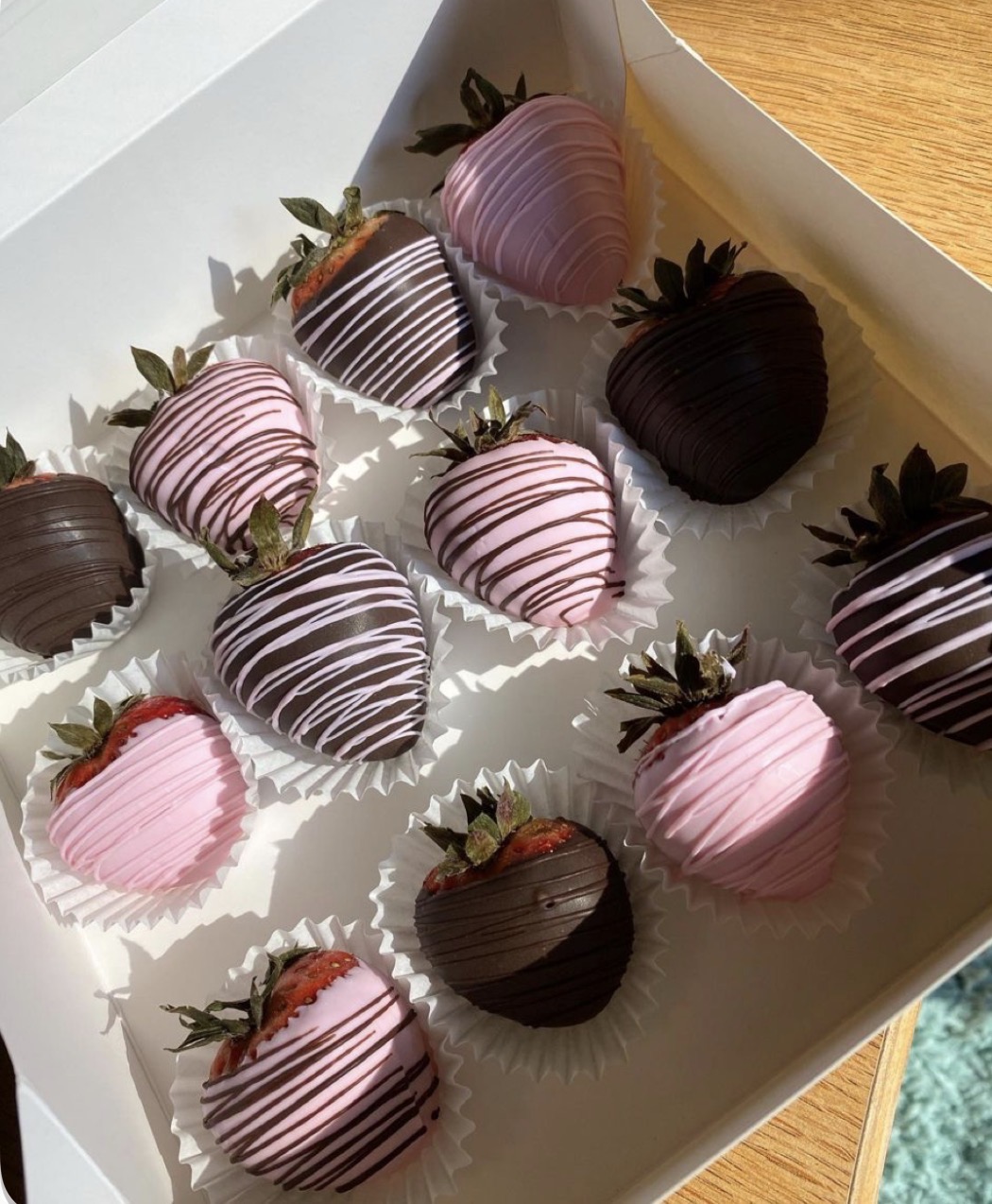 Pink and chocolate drizzled strawberries