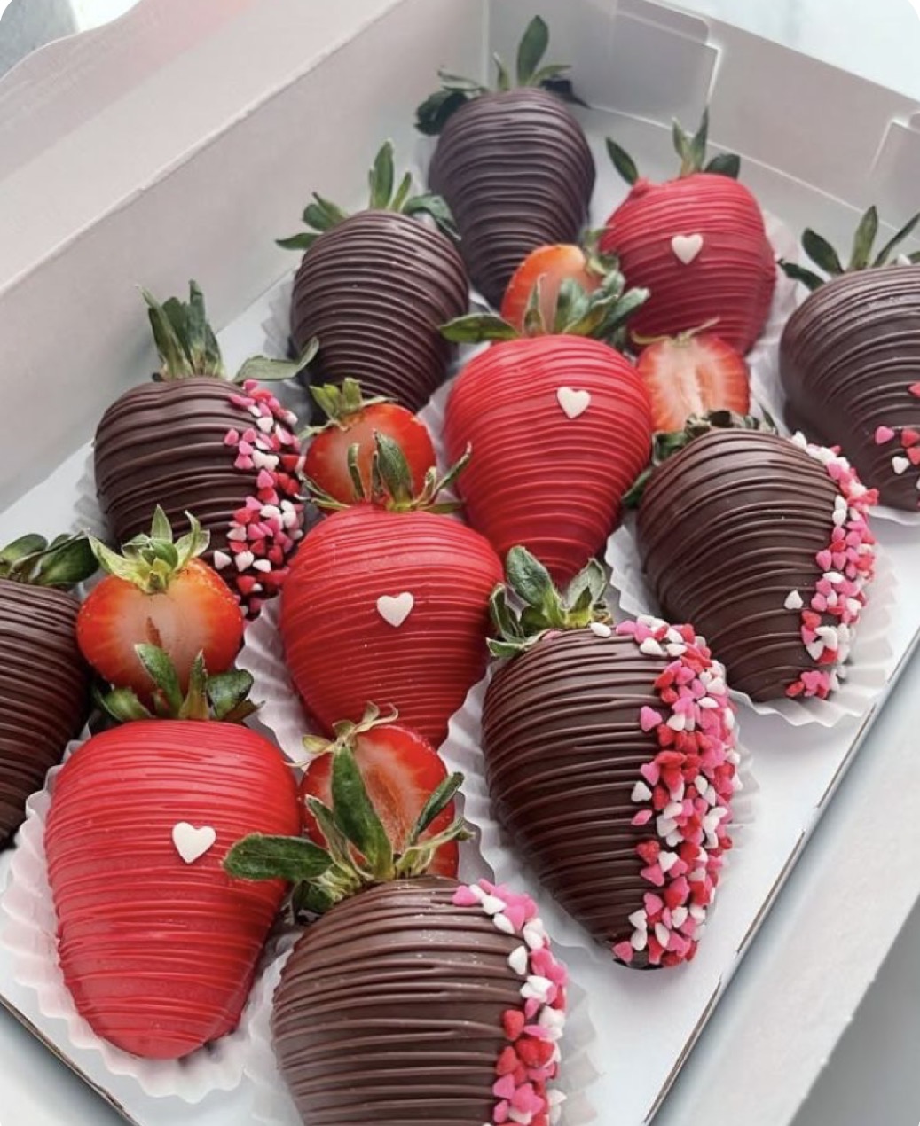 Red and chocolate covered strawberries with hearts
